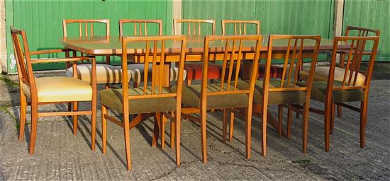 Gordon Russell, extending teak dining table with ten chairs including two carvers W.230cm